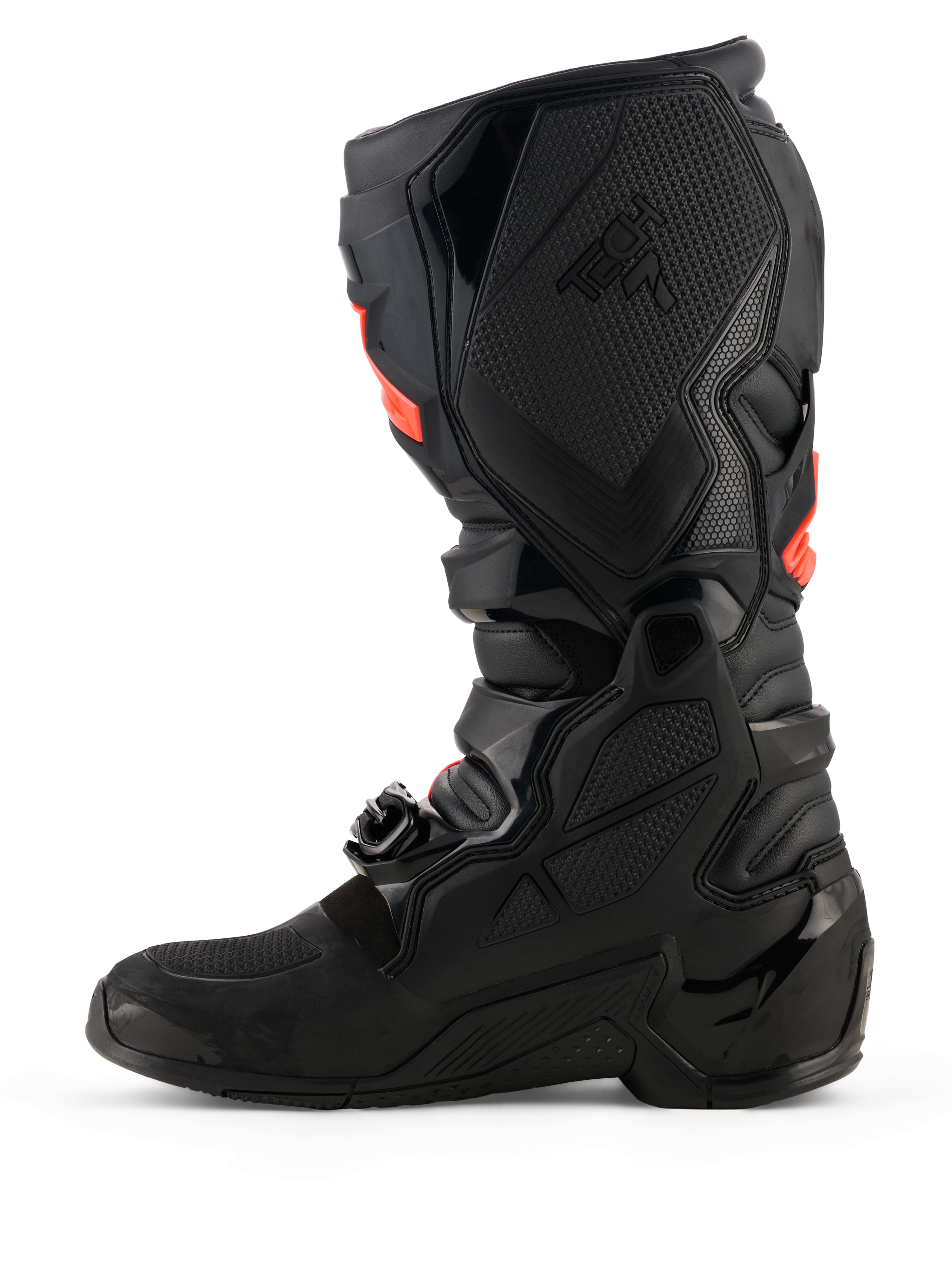 Alpinestars Tech 7 laarzen, motorcrosslaarzen, zwart met fluorode accenten, mediaal zijaanzicht met TPU beschermende schalen, gespsysteem en getextureerde grippanelen voor off-road prestaties