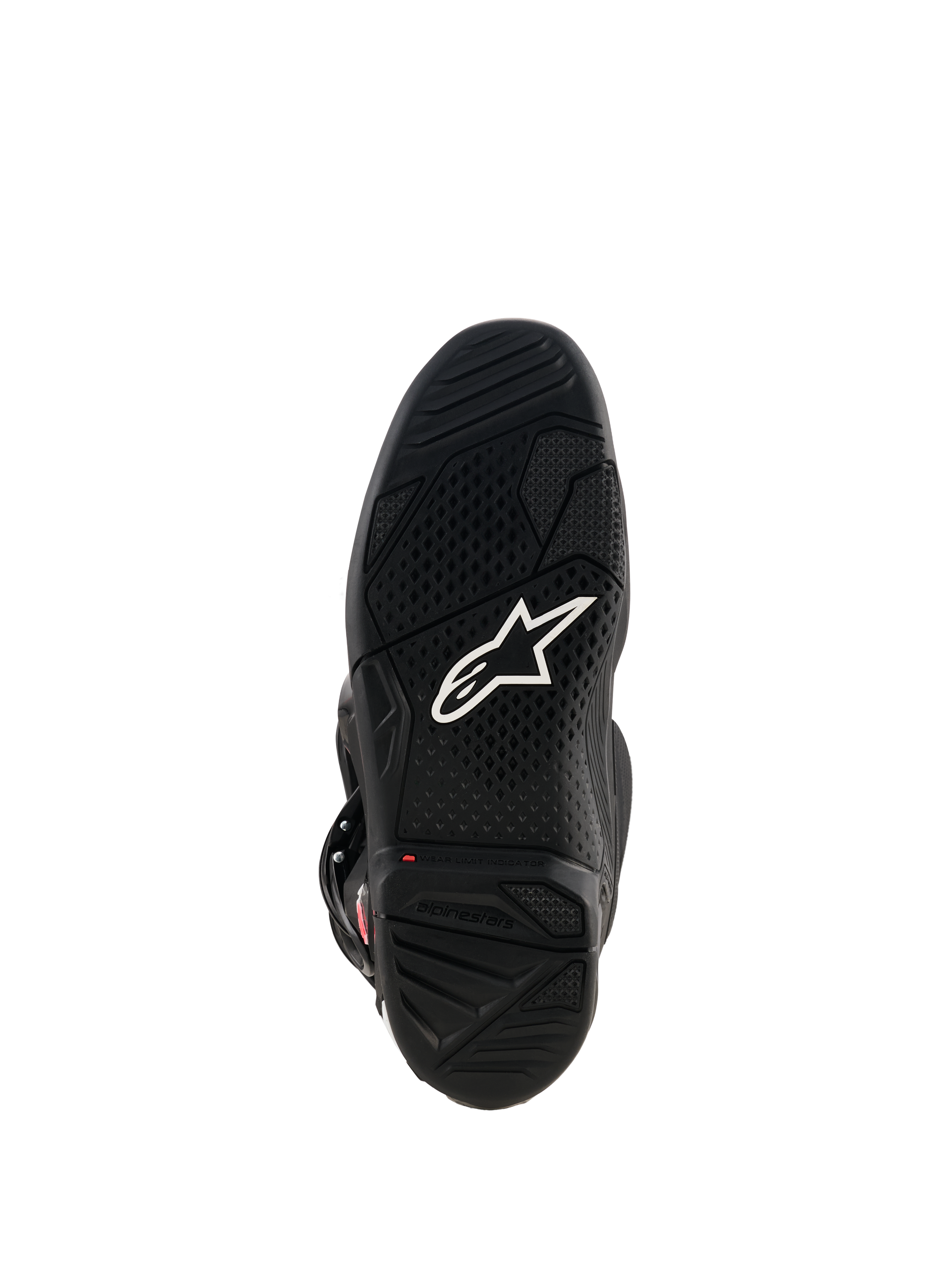 Alpinestars Tech 7 laarzen, aanzicht van de zwarte rubberen zool, voorzien van wit Astar-logo, getextureerd loopvlakprofiel en een rode slijtage-indicator voor motorcross prestaties.