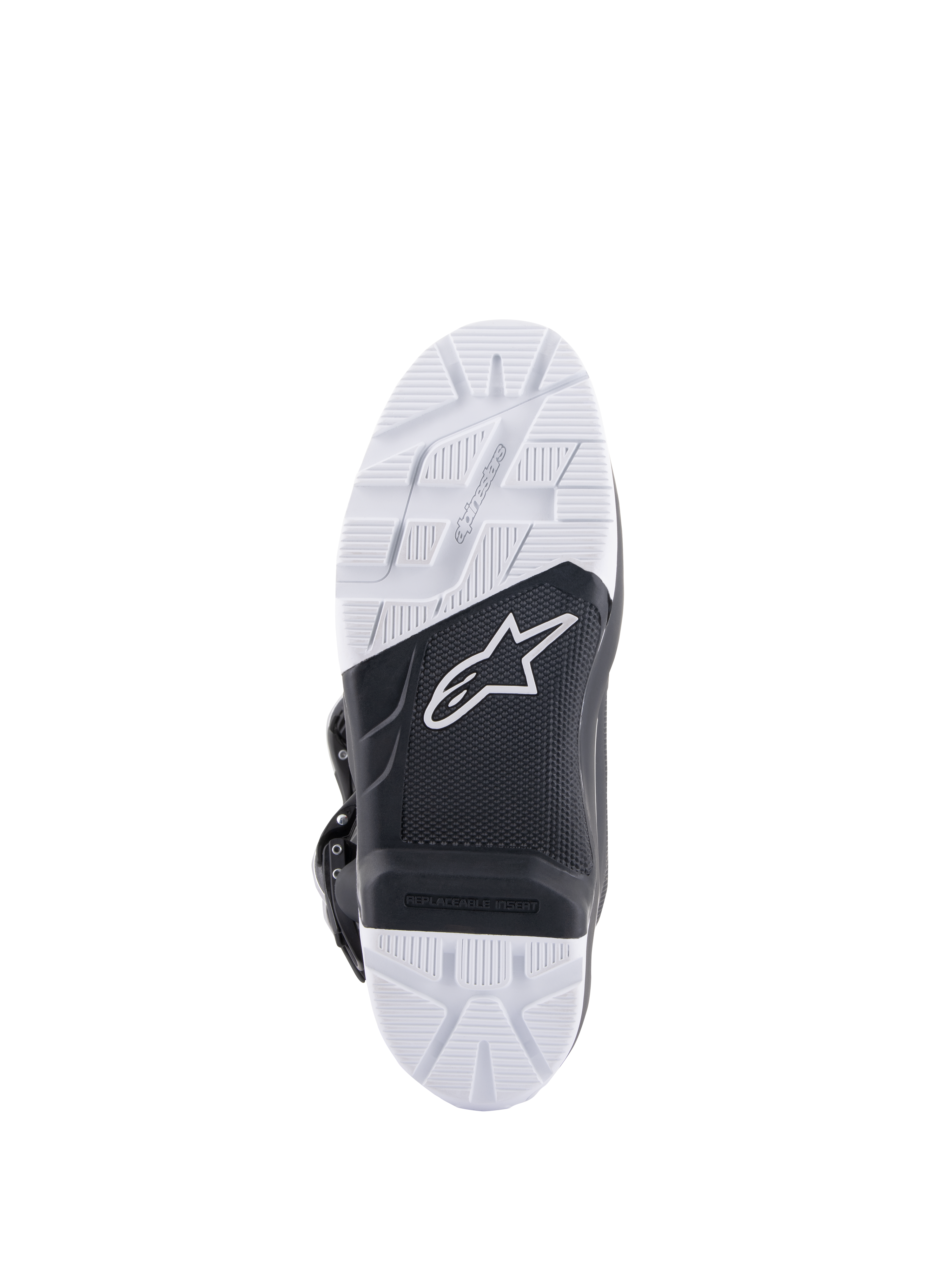 Alpinestars Tech 7 Enduro laarzen, onderaanzicht van de zool met de speciaal ontwikkelde samengestelde buitenzool, zwart-wit tweekleurig ontwerp met getextureerde grippatronen, wit ster-logo en een vervangbare voetsteun-insert.