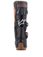Alpinestars Tech 7 Enduro laarzen, zwart en donkerbruin, achteraanzicht met Achilles accordeon-flexzones en TPU-bescherming, voorzien van wit Alpinestars sterlogo en tan hielaccenten, robuust ontwerp voor Enduro en off-road rijden.