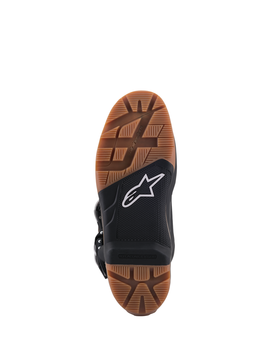 Alpinestars Tech 7 Enduro laarzen, close-up van de zool, met een bruin rubberen profiel en een zwart middengedeelte met een wit ster-logo, voorzien van een vervangbare voetsteuninzet voor superieure off-road grip.