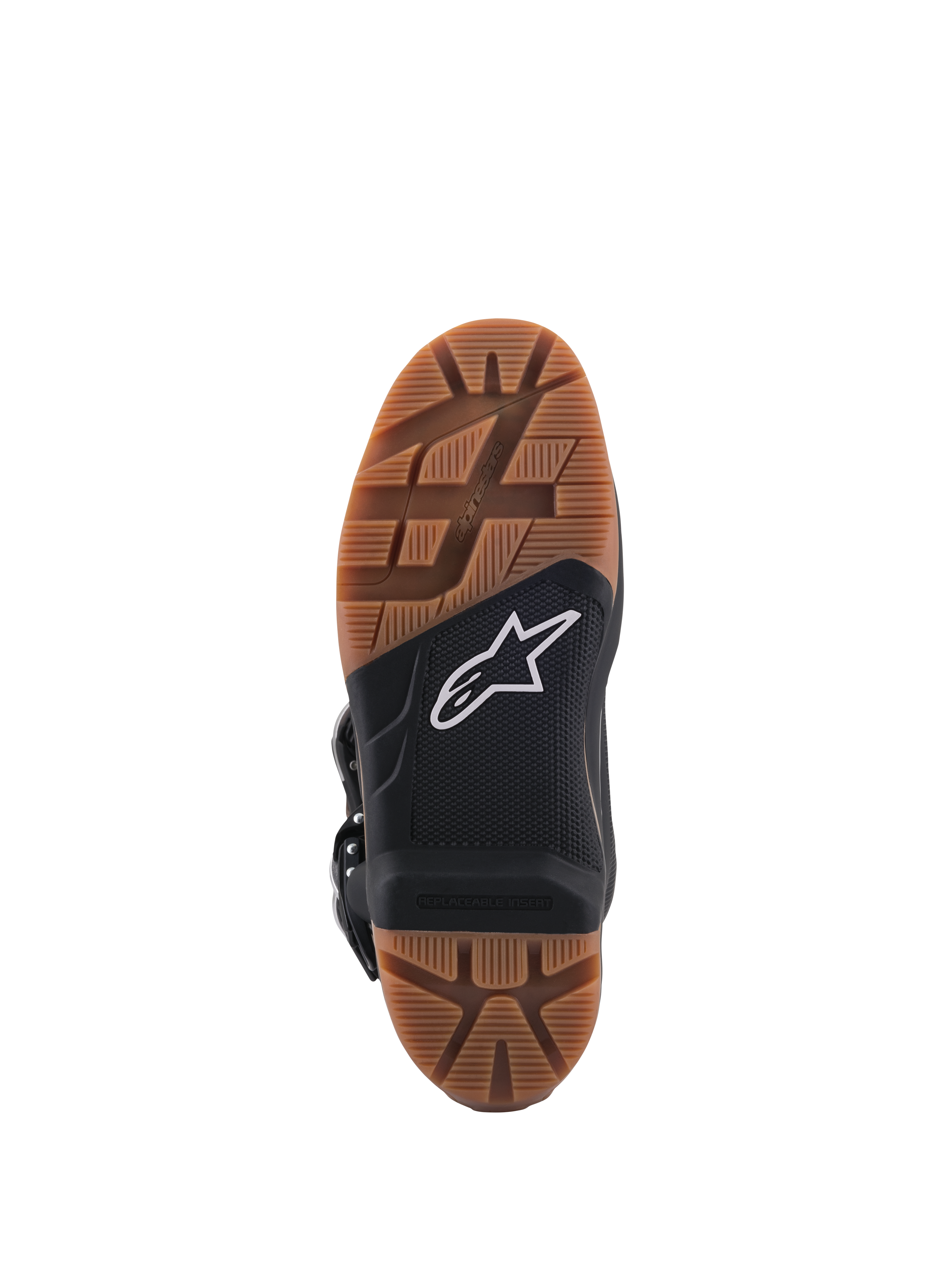 Alpinestars Tech 7 Enduro laarzen, close-up van de zool, met een bruin rubberen profiel en een zwart middengedeelte met een wit ster-logo, voorzien van een vervangbare voetsteuninzet voor superieure off-road grip.