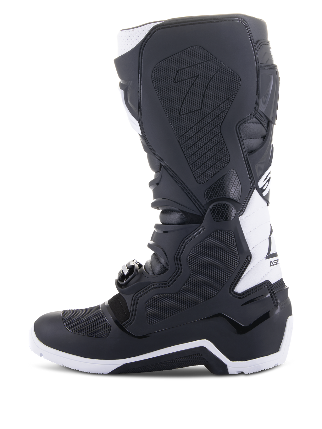 Alpinestars Tech 7 Enduro Drystar® Boots, Enduro Motorcycle Boots, Black and White, medial side view featuring honeycomb textured grip panels, TPU construction, and white accents on the heel and upper calf, professional off-road footwear