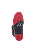 Honda Tech 7 Enduro Drystar® laarzen, zwart en helderrood, aanzicht van de zool met profiel voor veel grip en vervangbaar inzetstuk, rubberen constructie met dubbele dichtheid, wit Alpinestars-logo op een zwart paneel met textuur.