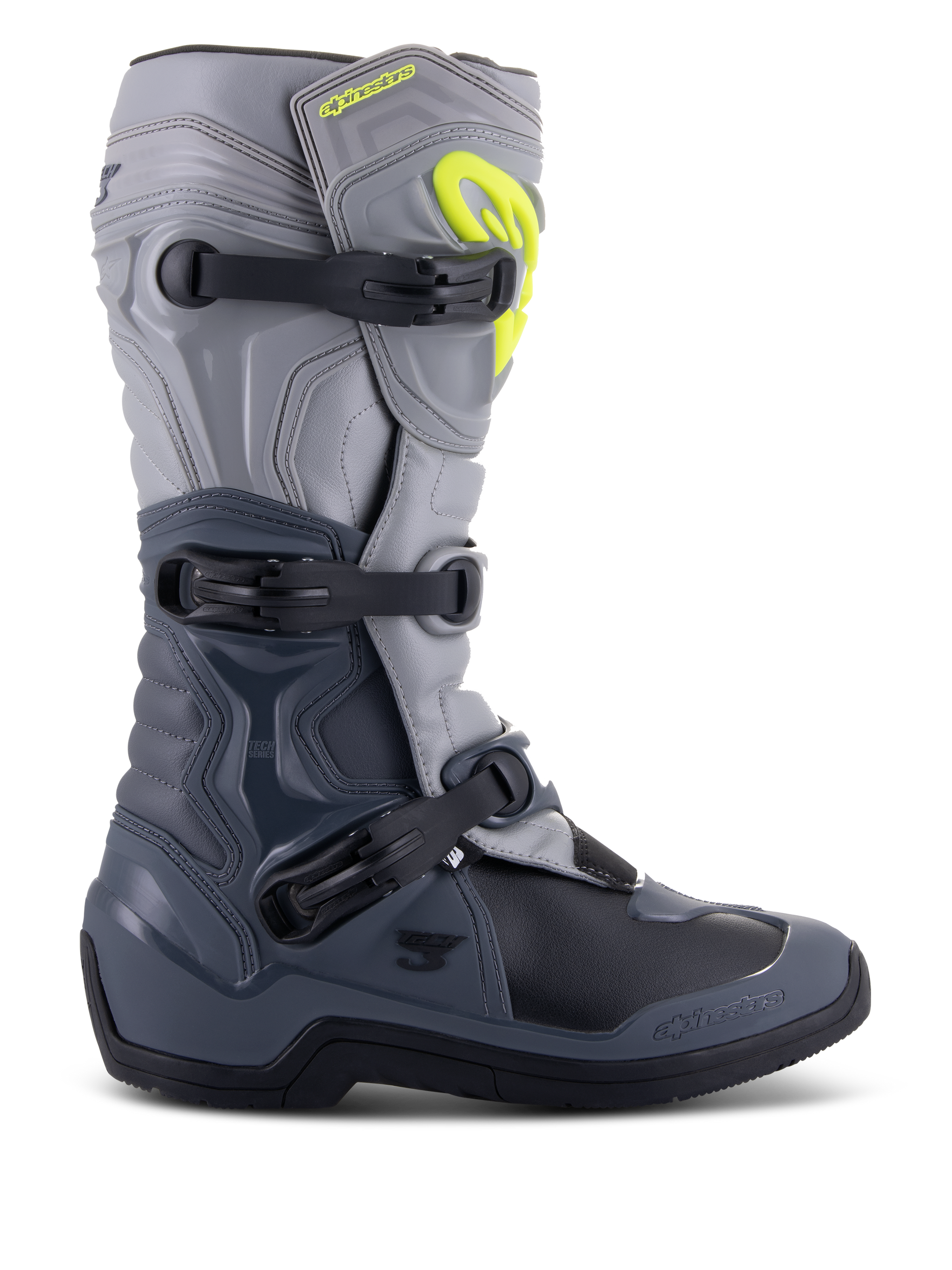Alpinestars Tech 3 laarzen, motocrosslaarzen, donkergrijs, lichtgrijs en zwart, zijaanzicht met drie zwarte polymeer gespen, TPU-beschermingspanelen en een felgeel Alpinestars-logo op de bovenzijde van het scheenbeen