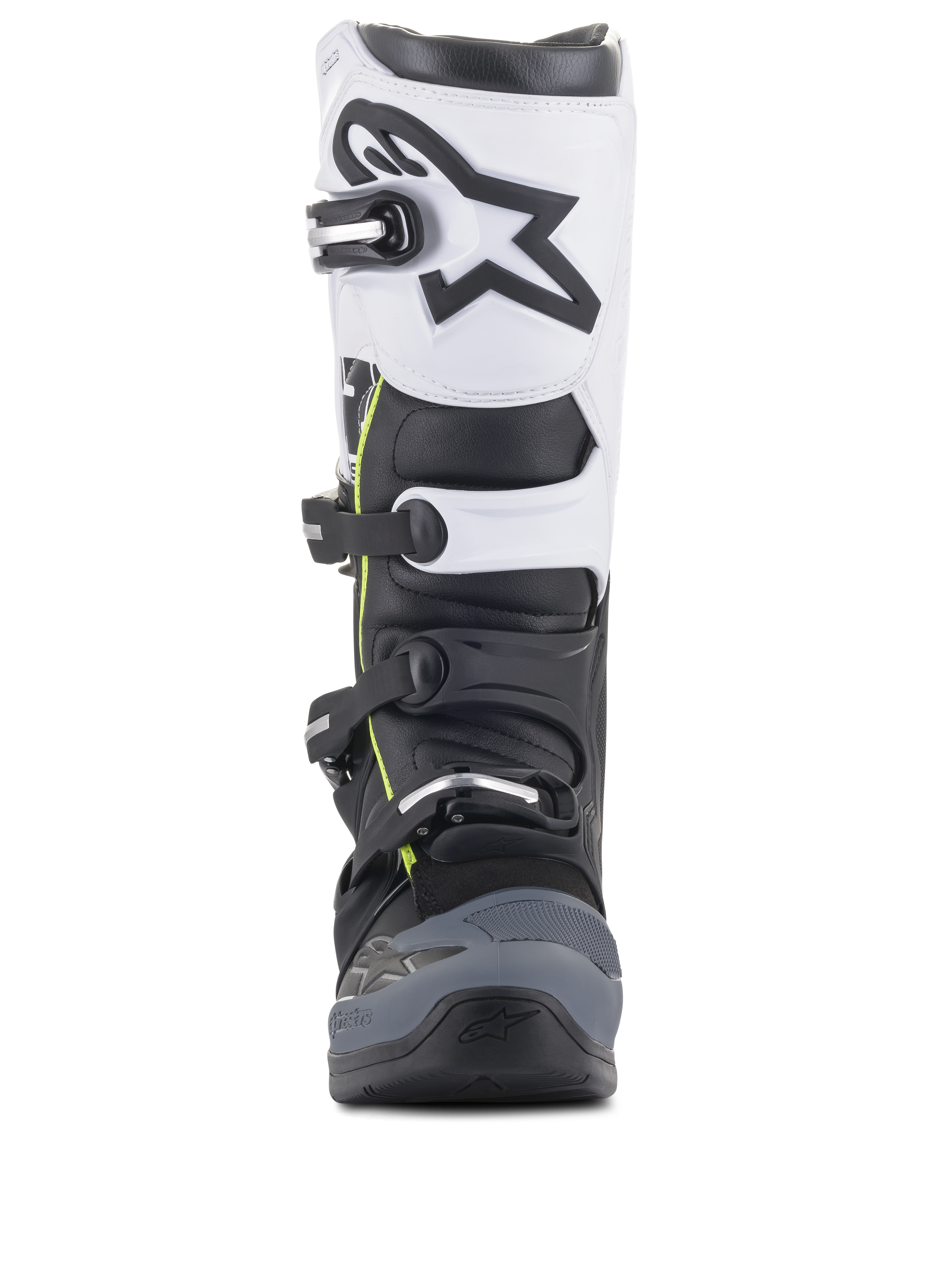 Alpinestars Tech 5 laarzen, motorcrosslaarzen, zwart, donkergrijs en wit, vooraanzicht met een sluitingssysteem met meerdere gespen, wit bovenpaneel met zwart Astars-logo, donkergrijze verstevigde neus en subtiele gele accenten