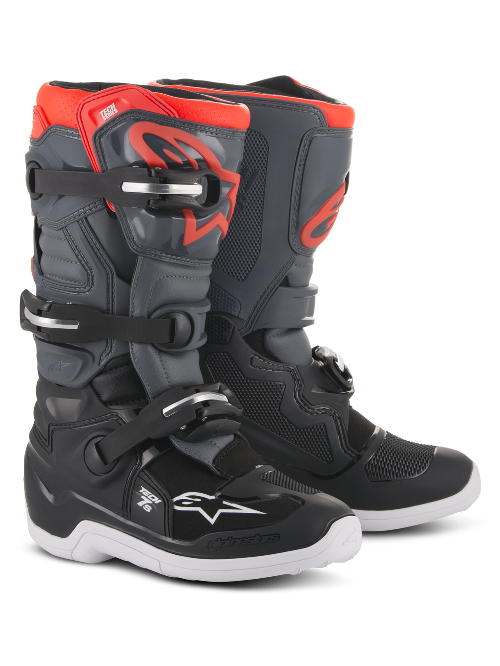 Alpinestars Youth Tech 7S Boots, motorcrosslaarzen, zwart, donkergrijs en fluorescerend rood, voorzien van een sluitsysteem met vier gespen, beschermende TPU-scheenplaat, witte buitenzool en rood Alpinestars-logo, ontworpen voor jeugdige off-road rijders.