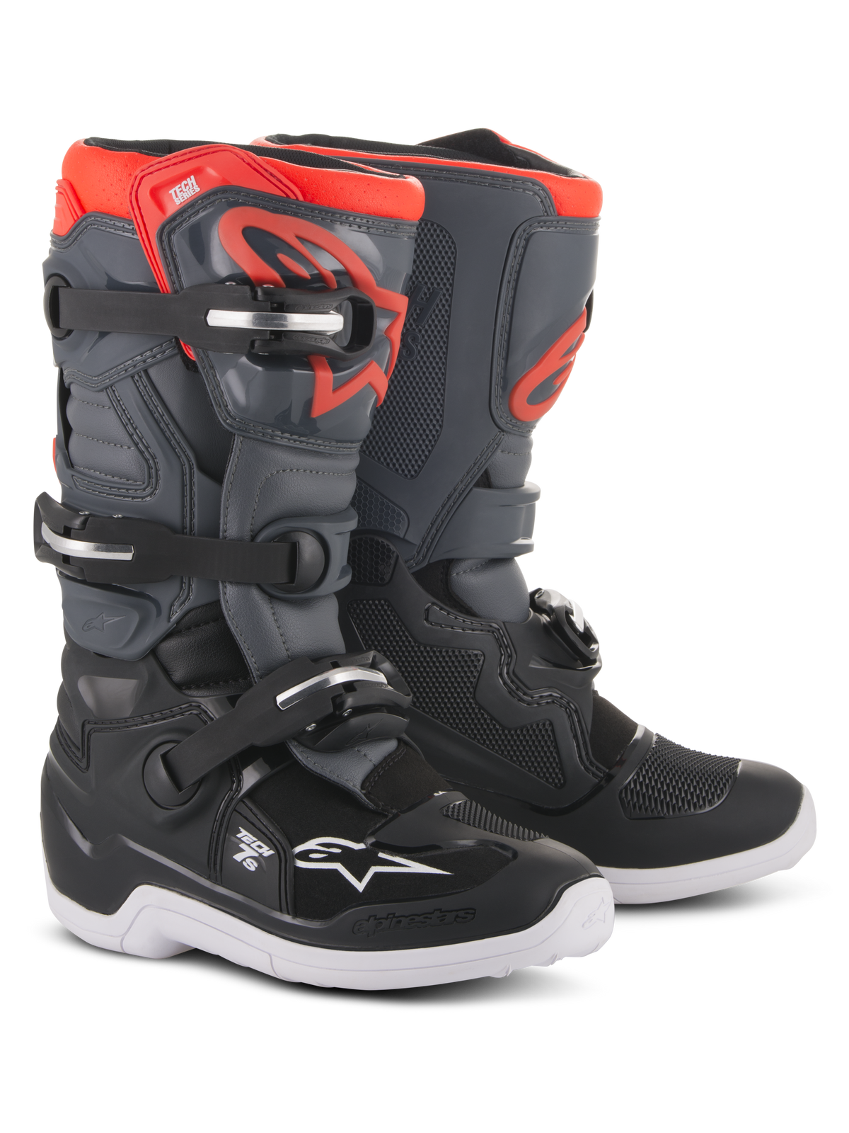 Alpinestars Youth Tech 7S Boots, motorcrosslaarzen, zwart, donkergrijs en fluorescerend rood, voorzien van een sluitsysteem met vier gespen, beschermende TPU-scheenplaat, witte buitenzool en rood Alpinestars-logo, ontworpen voor jeugdige off-road rijders.
