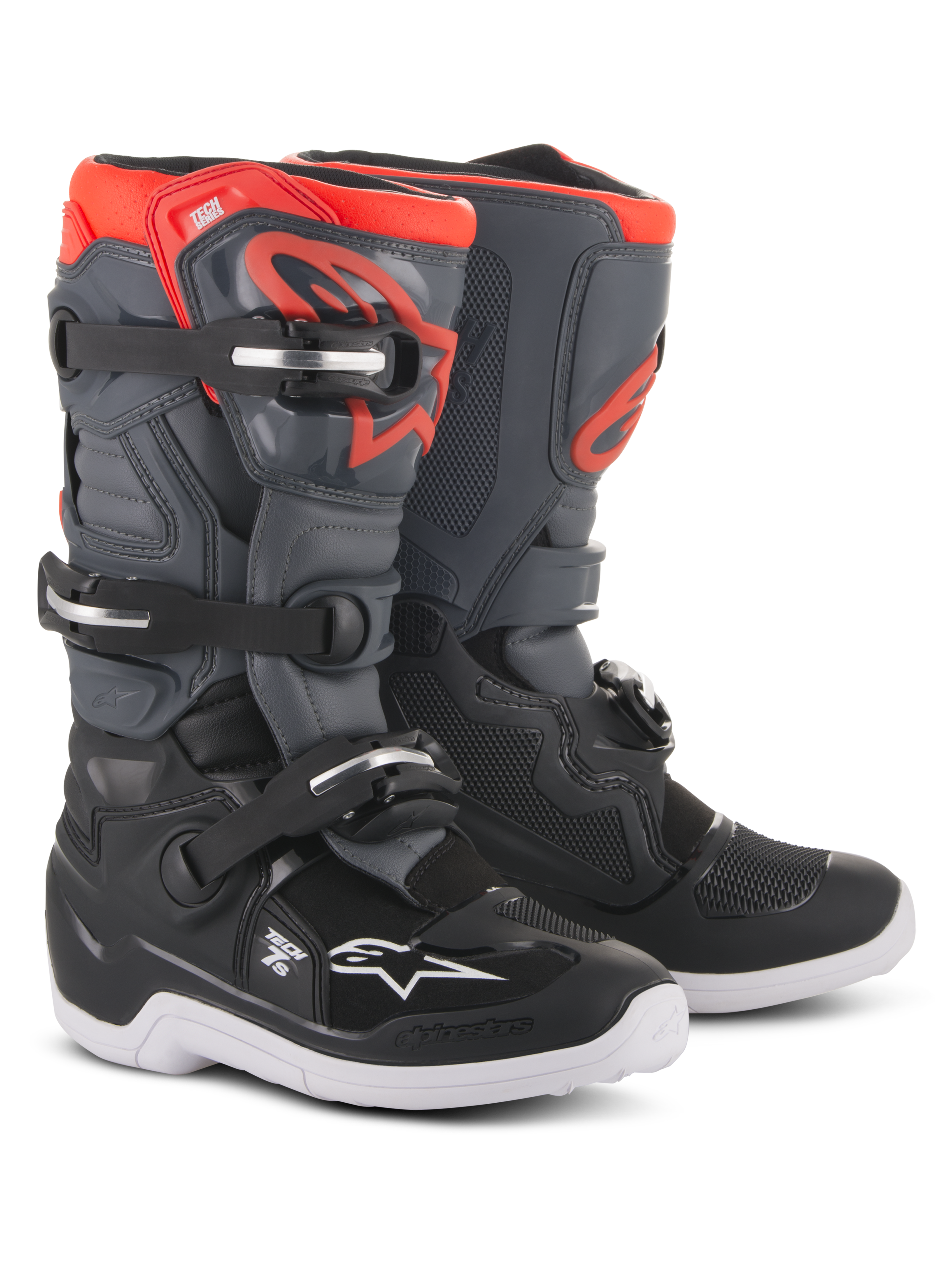 Alpinestars Youth Tech 7S Boots, motorcrosslaarzen, zwart, donkergrijs en fluorescerend rood, voorzien van een sluitsysteem met vier gespen, beschermende TPU-scheenplaat, witte buitenzool en rood Alpinestars-logo, ontworpen voor jeugdige off-road rijders.