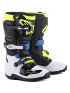 Alpinestars Youth Tech 7S Boots, motorcrosslaarzen, zwart, blauw, fluogeel en wit, voorzien van stevige gespsluitingen, TPU-scheenplaten en een flexibel draaisysteem voor junior off-road prestaties.