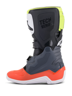 Alpinestars Youth Tech 7S laarzen, motocrosslaarzen, donkergrijs met rode en fluorescerend gele accenten, zijaanzicht, witte zool, 'TECH SERIES' branding en duurzame TPU-beschermingspanelen.