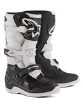 Alpinestars Youth Tech 7S laarzen, jeugd motorcrosslaarzen, zwart en wit, voorzien van een verstelbaar gespsluitsysteem, TPU-scheenbeschermer en draaisysteem, duurzame constructie met dikke zolen voor off-road rijden