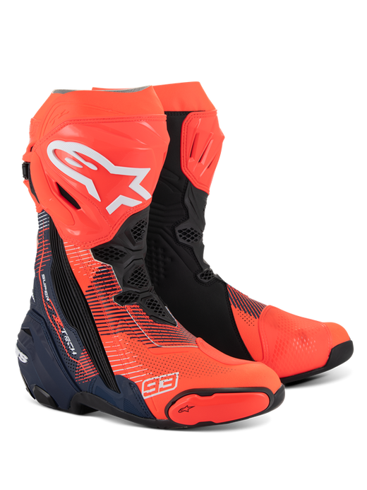 Alpinestars Supertech R Vented MM93 Replica Boots, high-performance motorcycle racing boots in Red Fluo, Dark Blue, and Black, featuring "93" branding, perforated material for ventilation, and integrated protective sliders.