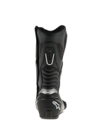 Alpinestars SMX S laarzen, zwart, achteraanzicht, met verstevigde hielkap met wit logo, zilveren branding en harmonica-flexpanelen voor extra mobiliteit en bescherming