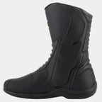 Alpinestars Origin Drystar® laarzen, zwarte touring motorlaarzen, zijaanzicht van de binnenzijde met de flap van het instapsysteem, microvezel bovenwerk met accordeon-flexzones aan de voor- en achterkant, duurzaam waterdicht ontwerp voor weg- en adventure-ritten
