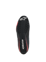 Alpinestars Celer schoenen, motorschoenen, zwart en felrood, onderaanzicht van de getextureerde rubberen zool met witte Alpinestars-branding en rode accenten.