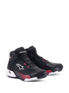 Alpinestars CR-X Drystar® motorschoenen voor dames, zwart, wit en Diva Pink, driekwart vooraanzicht, ripstop bovenwerk met wit Alpinestars-logo, roze accenten op de tussenzool en veteroogjes, gestroomlijnd en beschermend ontwerp voor touring