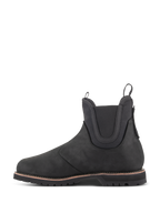 Alpinestars Turnstone schoenen, zwarte motorlaars in Chelsea-stijl, zijaanzicht, vervaardigd uit 1,5 mm runderleer met elastische enkelpanelen en treklussen aan de voor- en achterkant