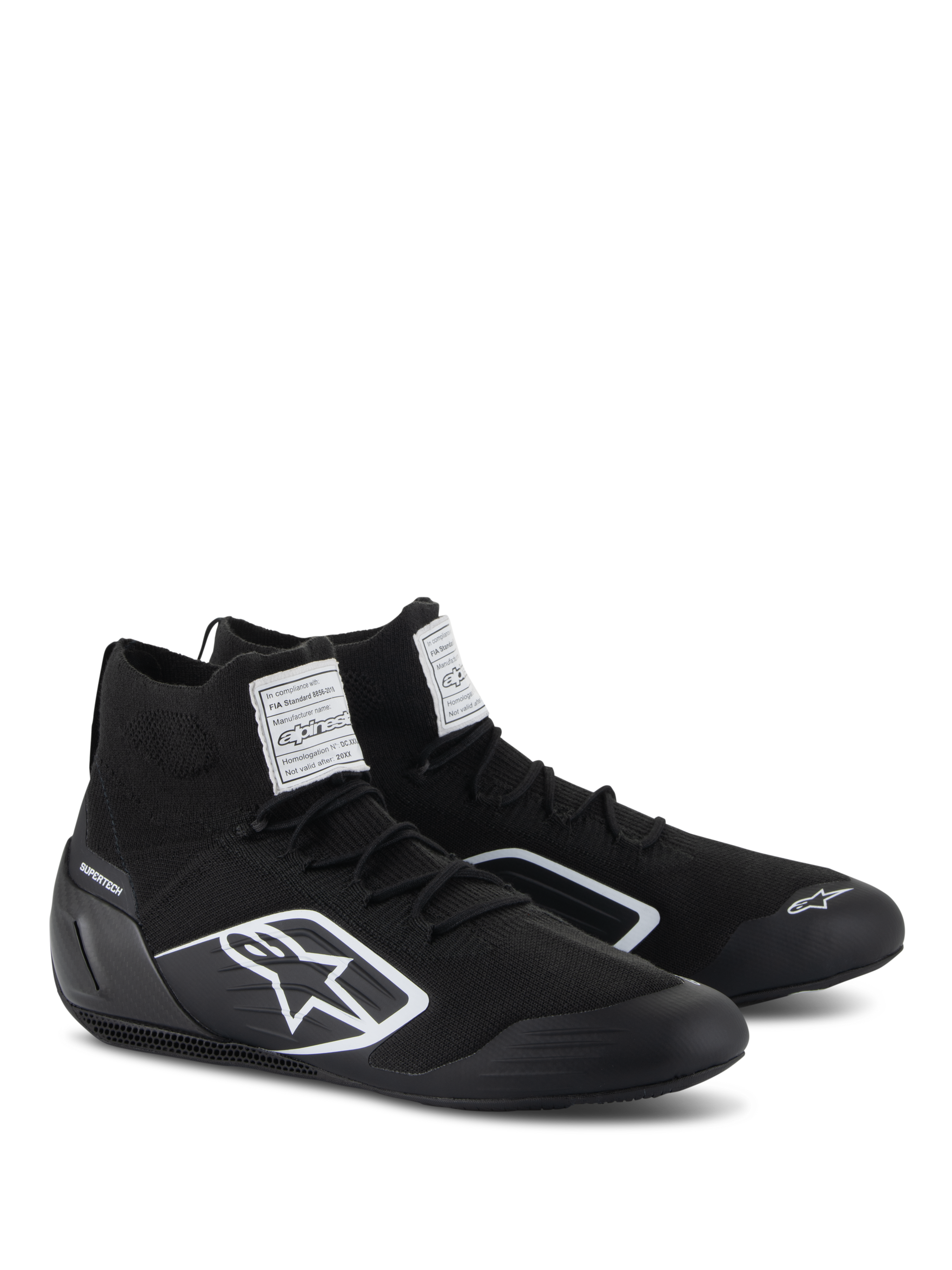 Alpinestars Supertech Shoes, Auto Racing Shoes, Black, featuring a fully knitted fire-retardant upper and carbon fiber heel cup, white Alpinestars logo on the side, FIA/SFI certification labels on the tongue, professional motorsport footwear with a sleek design