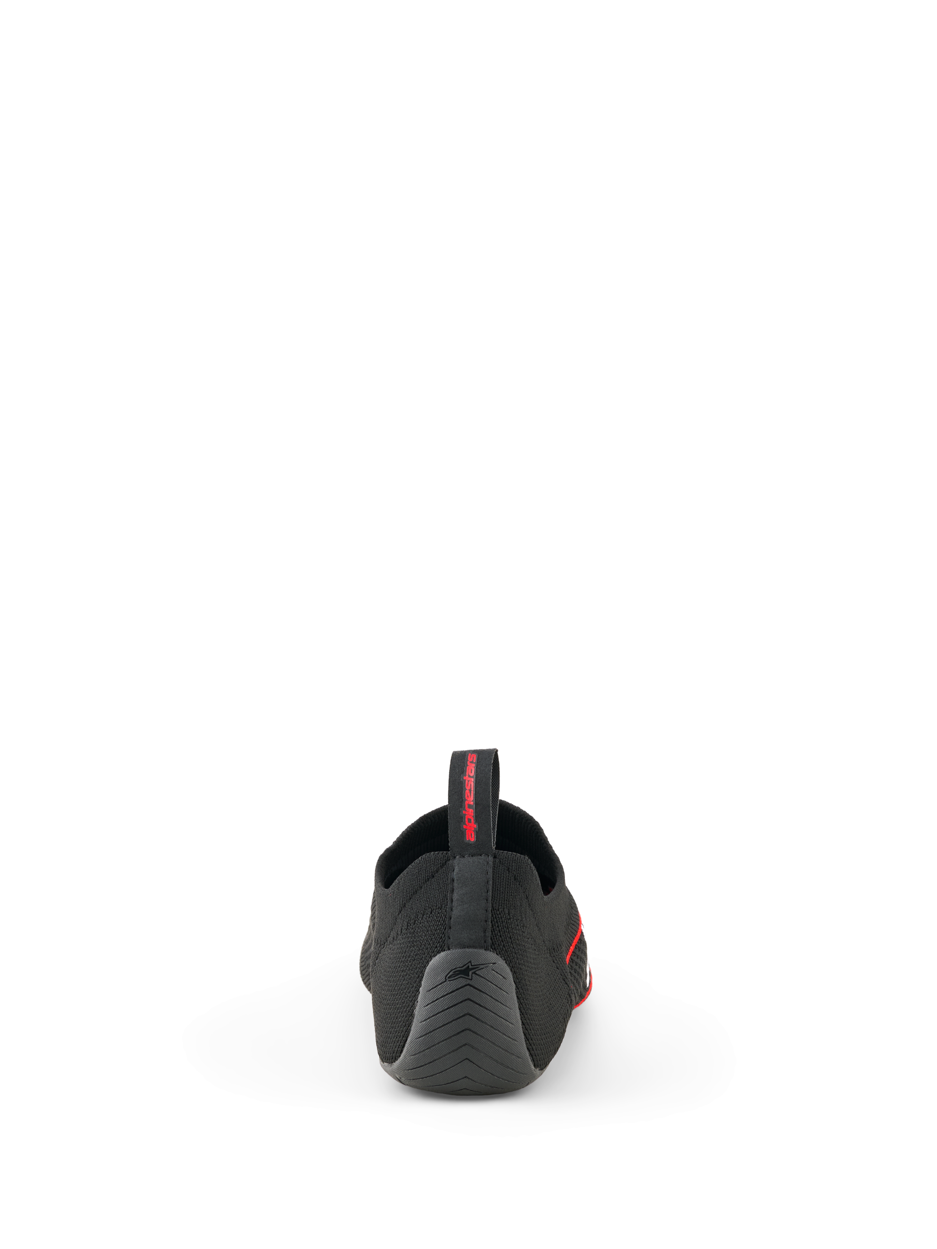 Alpinestars Tech Gaming Shoes, zwart, achteraanzicht met het naadloos gebreide bovenwerk, getextureerde rubberen hiel met ster-logo en treklus aan de achterzijde met rode branding, SIM-racing schoeisel