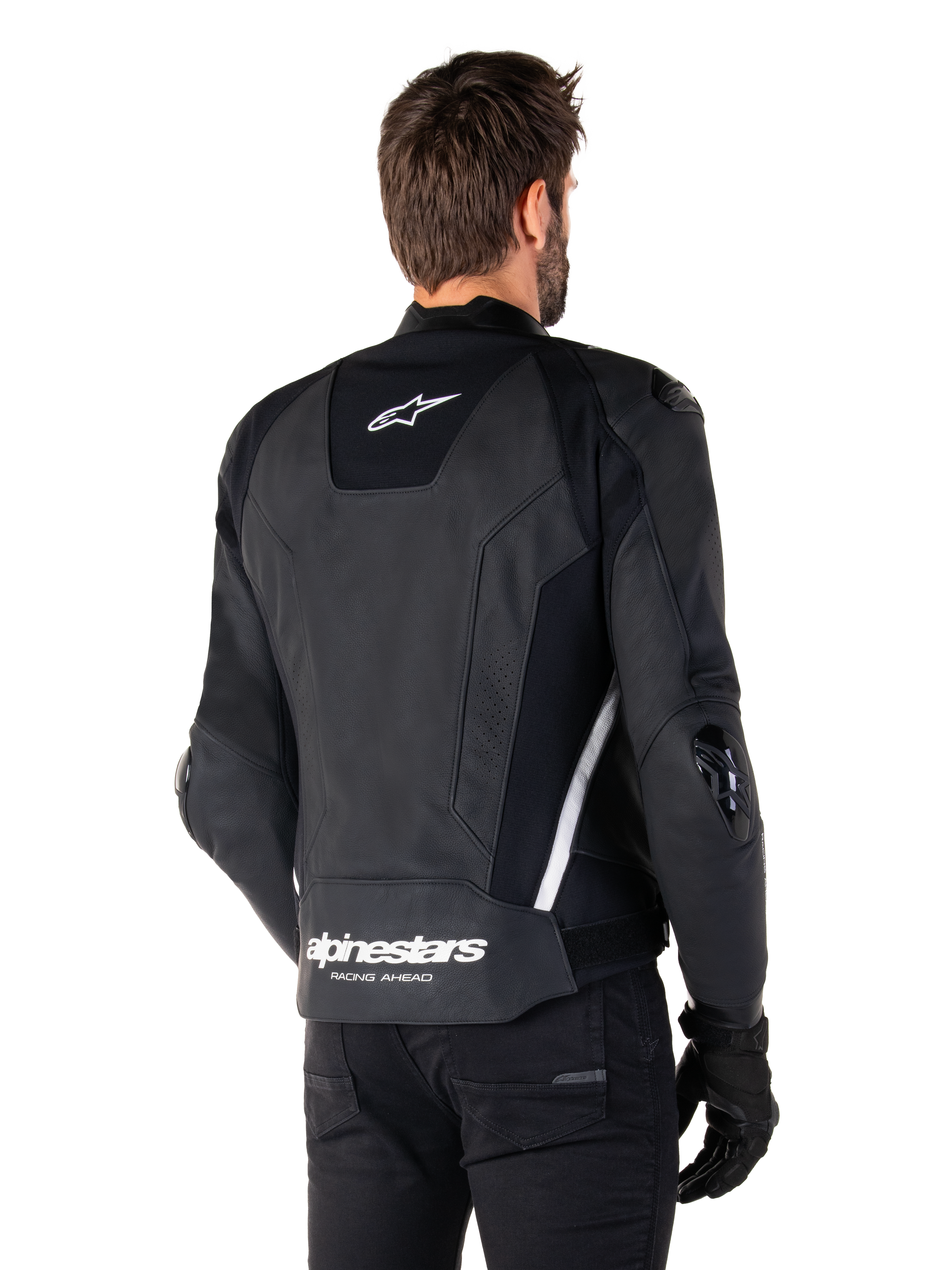 Alpinestars Missile V3 Leren Jas, achteraanzicht, zwart en wit, met het Alpinestars ster-logo op de bovenrug en woordmerk op de onderrug, beschermende sliders op ellebogen en schouders, premium lederen race-uitrusting