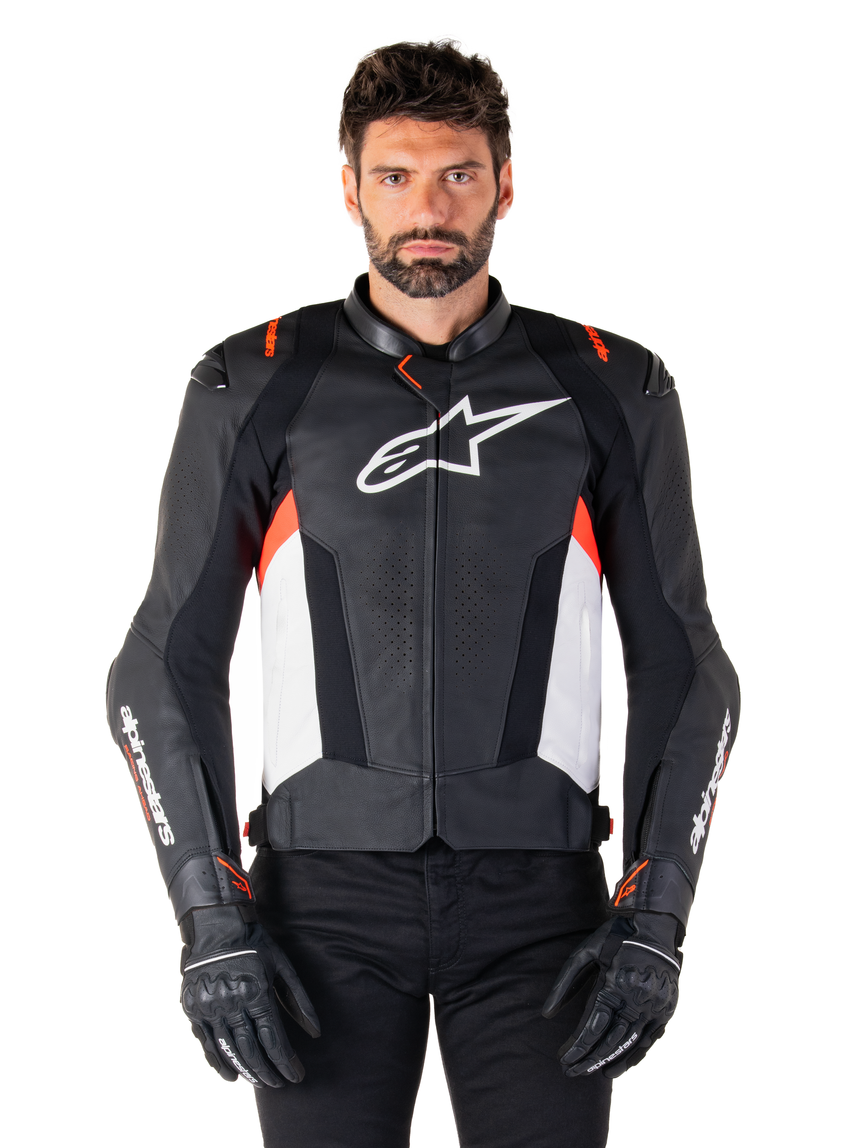 Alpinestars Missile V3 Leather Jacket, Black White and Red Fluo, premium racing sport jacket with bovine leather, featuring white chest logo and Alpinestars branding on sleeves, worn with black motorcycle gloves and pants