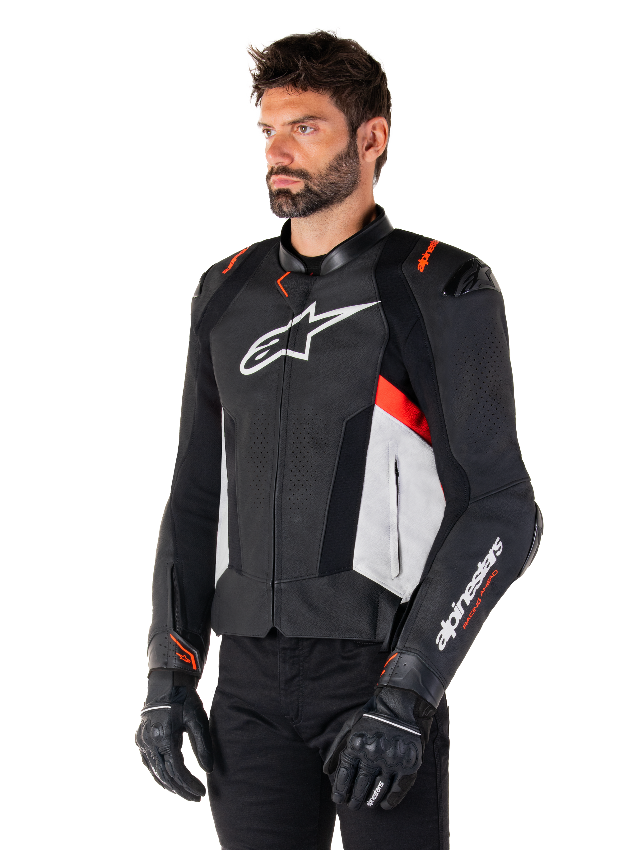 Alpinestars Missile V3 Leather Jacket, Black White and Red Fluo, racing sport motorcycle jacket worn by a model with black gloves and pants, featuring perforated leather panels and bold Alpinestars branding