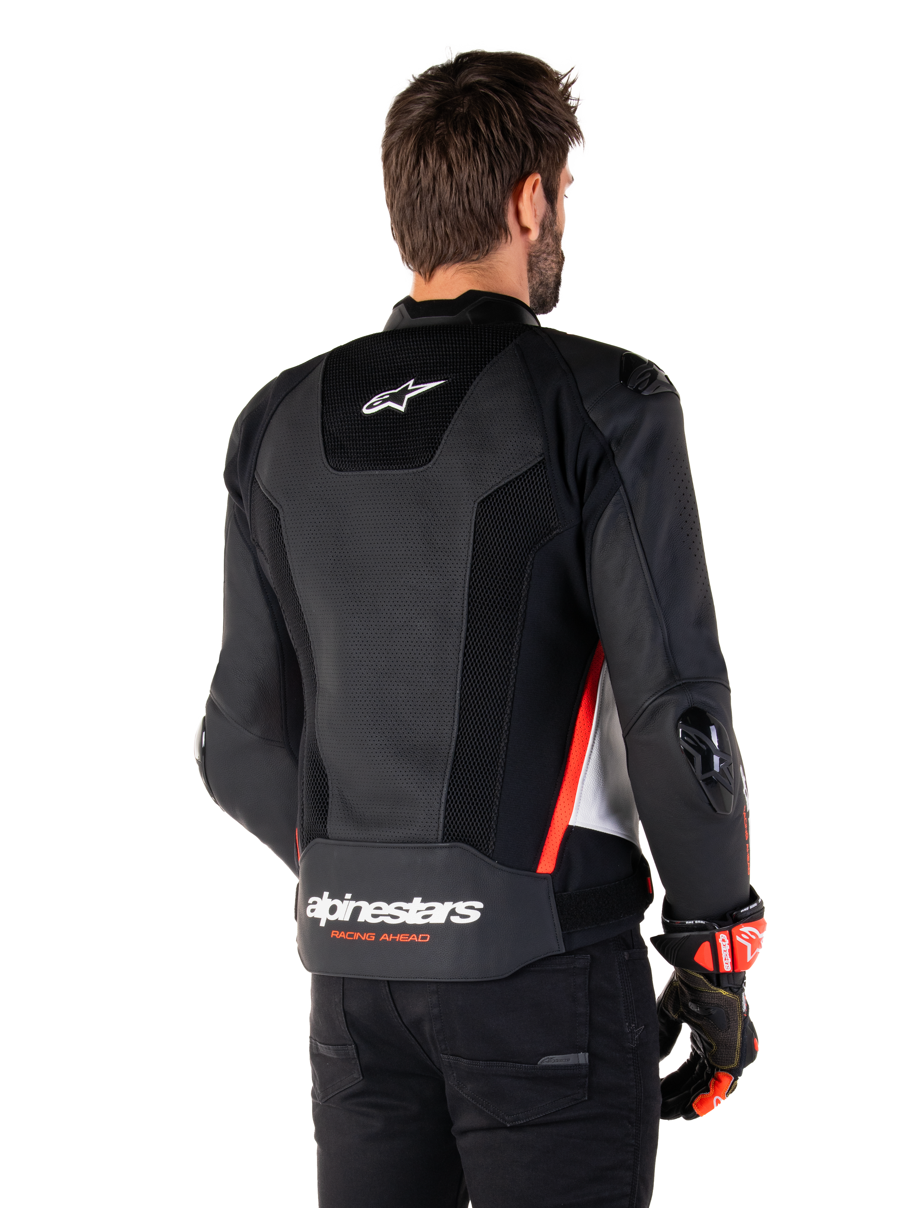 Alpinestars Missile V3 Airflow Leren Jas, achteraanzicht, zwart wit en rood fluo, met uitgebreide perforaties voor koeling, externe DFS-sliders op schouders en ellebogen, en Alpinestars-logo op de onderrug.