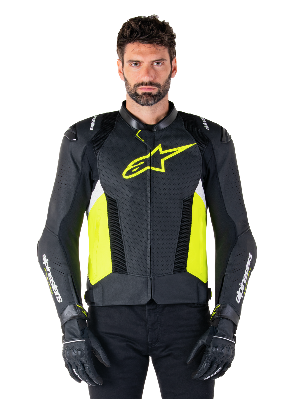 Alpinestars Missile V3 Airflow leren jas, sportieve motorjas, zwart, fluoriserend geel en wit, gedragen door een model met zwarte motorhandschoenen, voorzien van geperforeerd leer op de borst, een opvallend fluorgeel logo en witte merkdetails op de mouwen