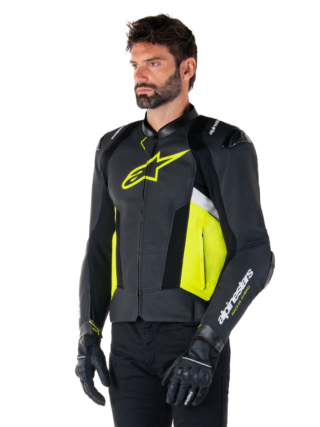 Mannelijk model draagt Alpinestars Missile V3 Airflow leren jas, zwart met Yellow Fluo en witte accenten, voorzien van geperforeerd leer voor maximale ventilatie, opvallend geel logo op de borst, gecombineerd met zwarte handschoenen en broek, sportieve motoruitrusting