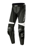 Alpinestars Stella Missile V3 lederen motorbroek, dames racebroek, zwart en wit, voorzien van accordeon stretchpanelen boven de knieën, geïntegreerde knee-sliders met Alpinestars-logo, witte accenten en een gestroomlijnde pasvorm voor sport- en circuitrijden