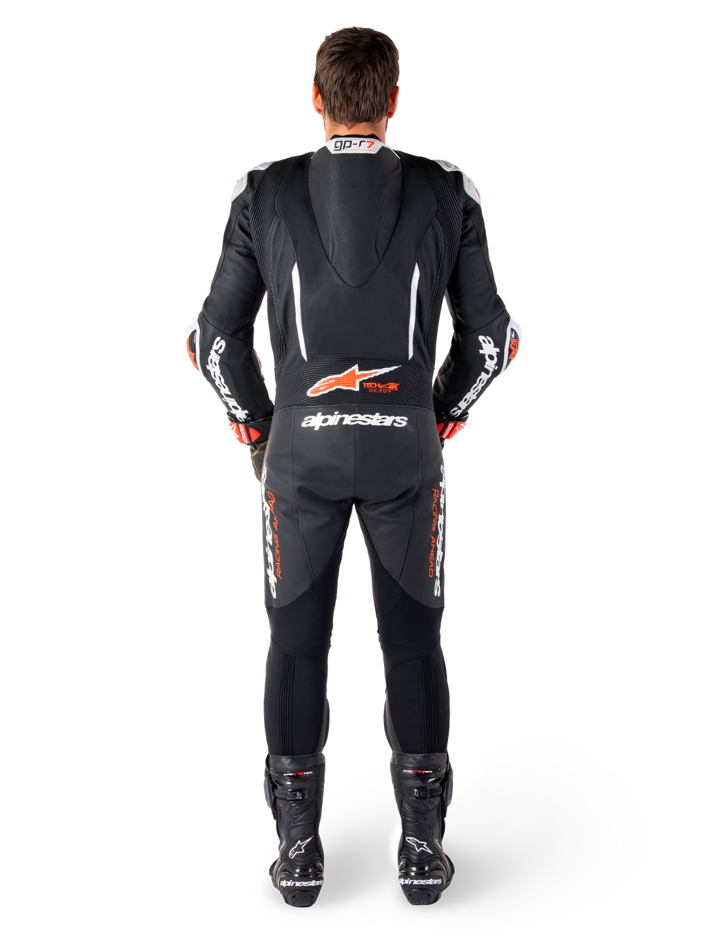 Alpinestars GP-R7 leren pak, zwart en wit, met aerodynamische speedhump en accordeonpanelen voor racing.
