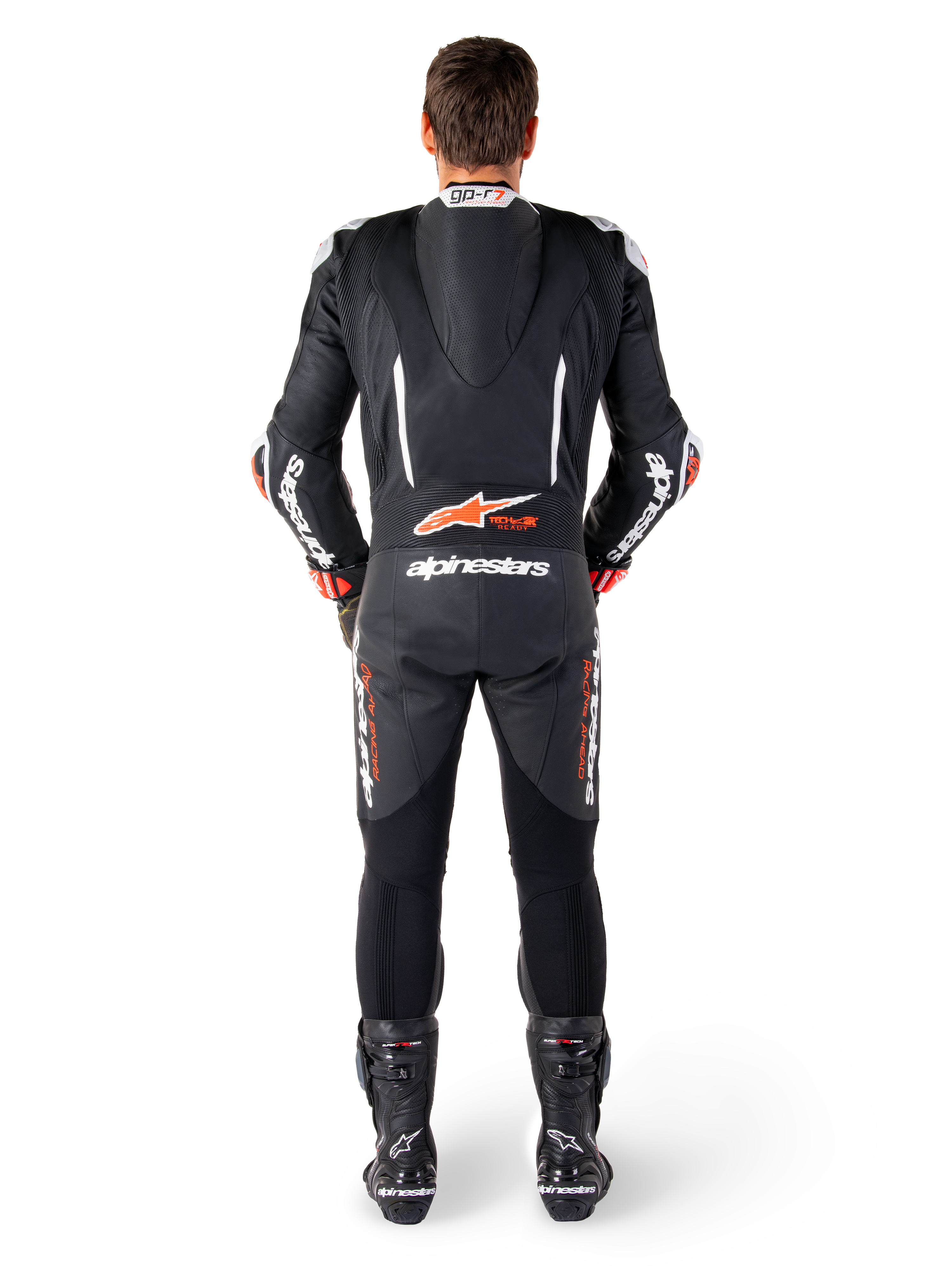 Alpinestars GP-R7 leren pak, zwart en wit, met aerodynamische speedhump en accordeonpanelen voor racing.