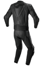 Alpinestars Missile V2 2-delig leren pak, leren racepak, volledig zwart, achteraanzicht met aerodynamische rug-hump met wit sterlogo, accordeon stretchpanelen in de taille en bij de schouders, en geperforeerde leren details voor sportief motorrijden