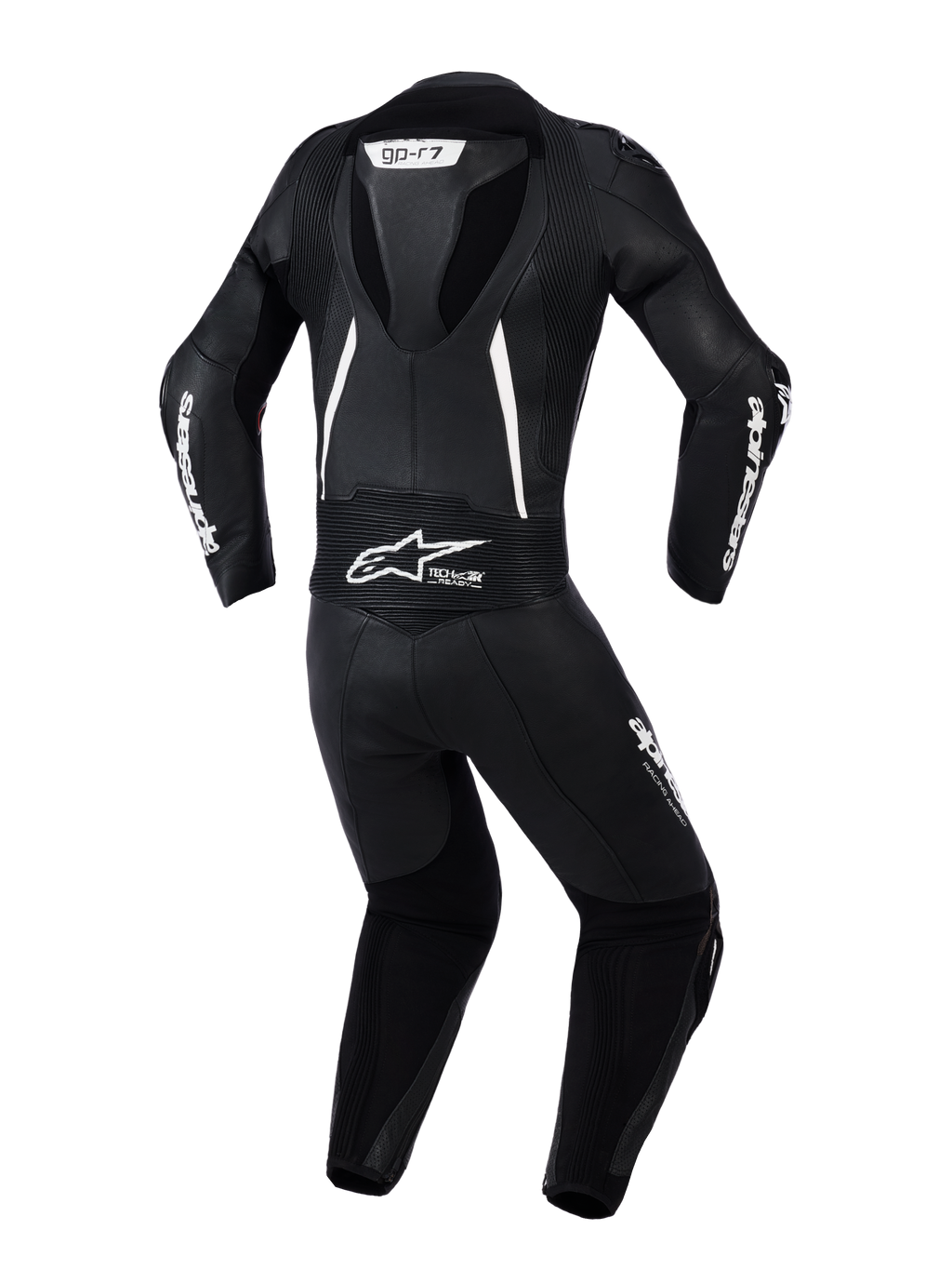 Alpinestars Stella GP-R7 2-delig leren dames motorpak, achteraanzicht in zwart met witte accenten, voorzien van een geïntegreerde aerodynamische bult, accordeon stretchpanelen op de schouders en onderrug, geperforeerd leer voor ventilatie en opvallende Alpinestars branding.