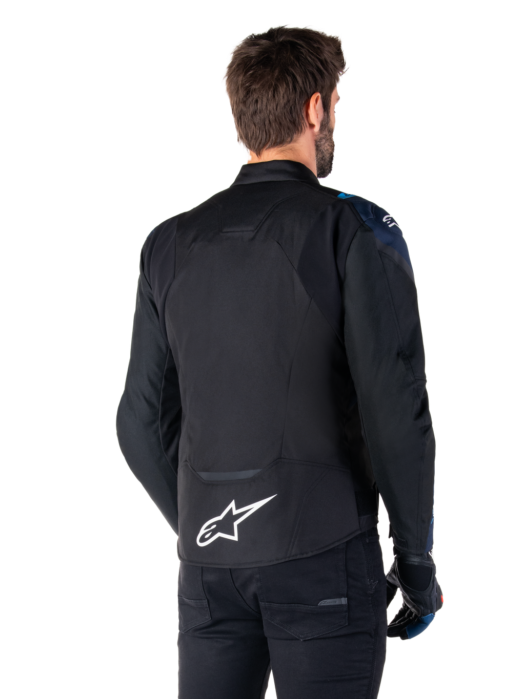 Alpinestars T-Jaws V4 Waterproof Jas, achteraanzicht, zwart met donkerblauwe en Blithe Blue accenten, wit sterlogo op de onderrug, sportief silhouet, gedragen met zwarte broek en motorhandschoenen