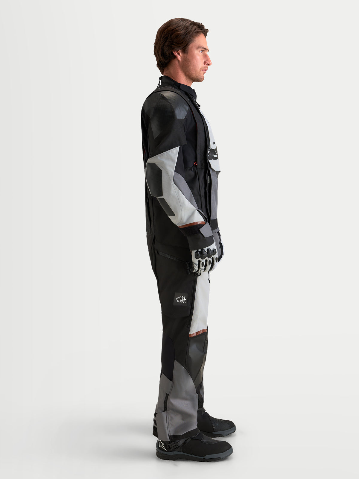 Alpinestars Harok V2 Drystar Gear Set, adventure touring motorcycle jacket and pants in black and gray, side profile view on a model wearing waterproof riding apparel