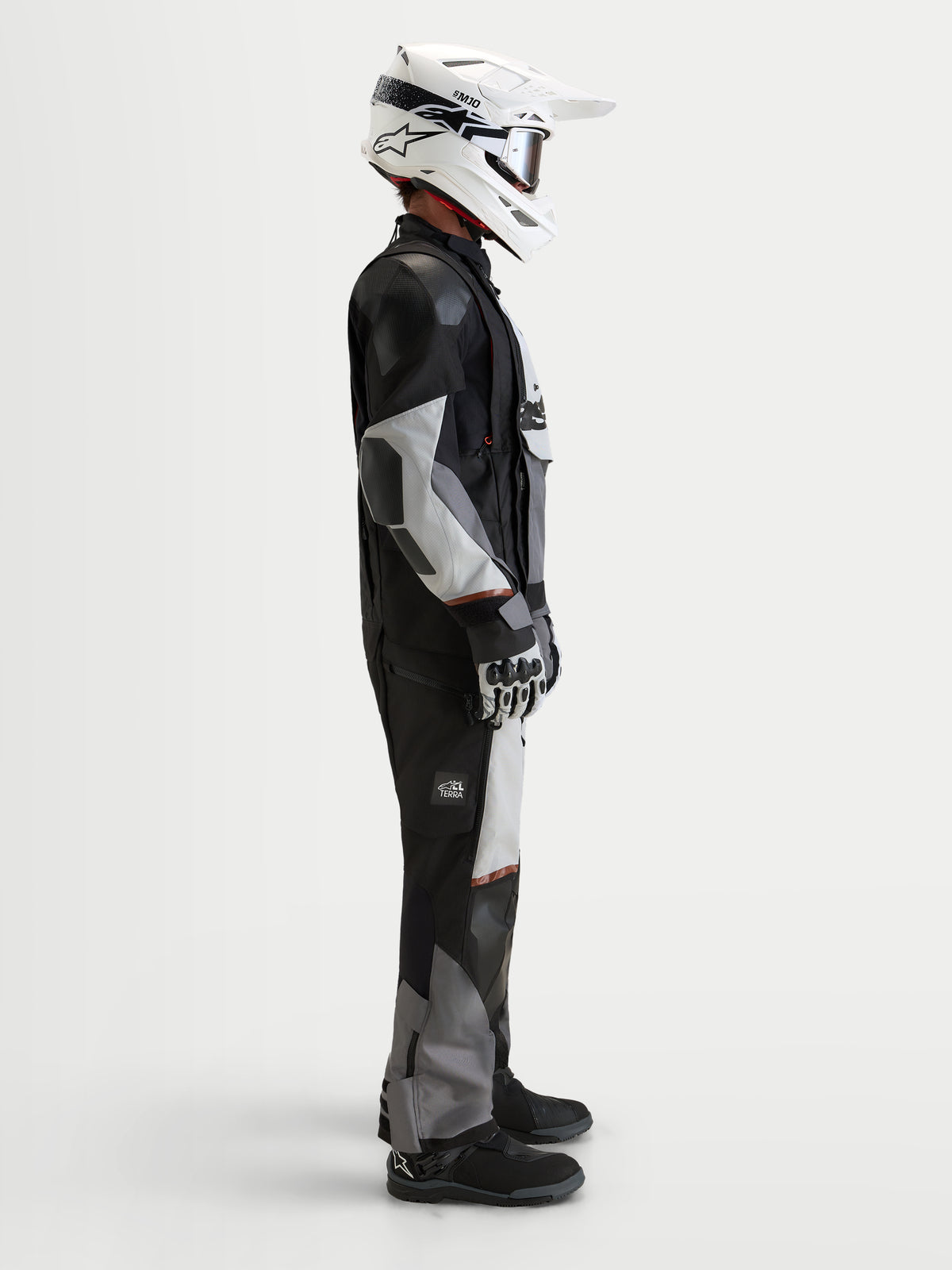 Alpinestars Harok V2 Drystar Gear Set, adventure touring motorcycle gear set in black and gray, side profile view of a model wearing a matching waterproof textile jacket, pants, helmet, and gloves