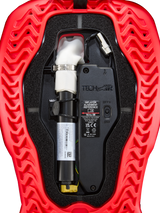 Tech-Air® 5 Plasma Airbag Replacement Canister, red and black, close-up view showing cylindrical inflator with white top, silver clamp, ON/OFF switch, technical components, wires, and wavy ribbed texture outer shell