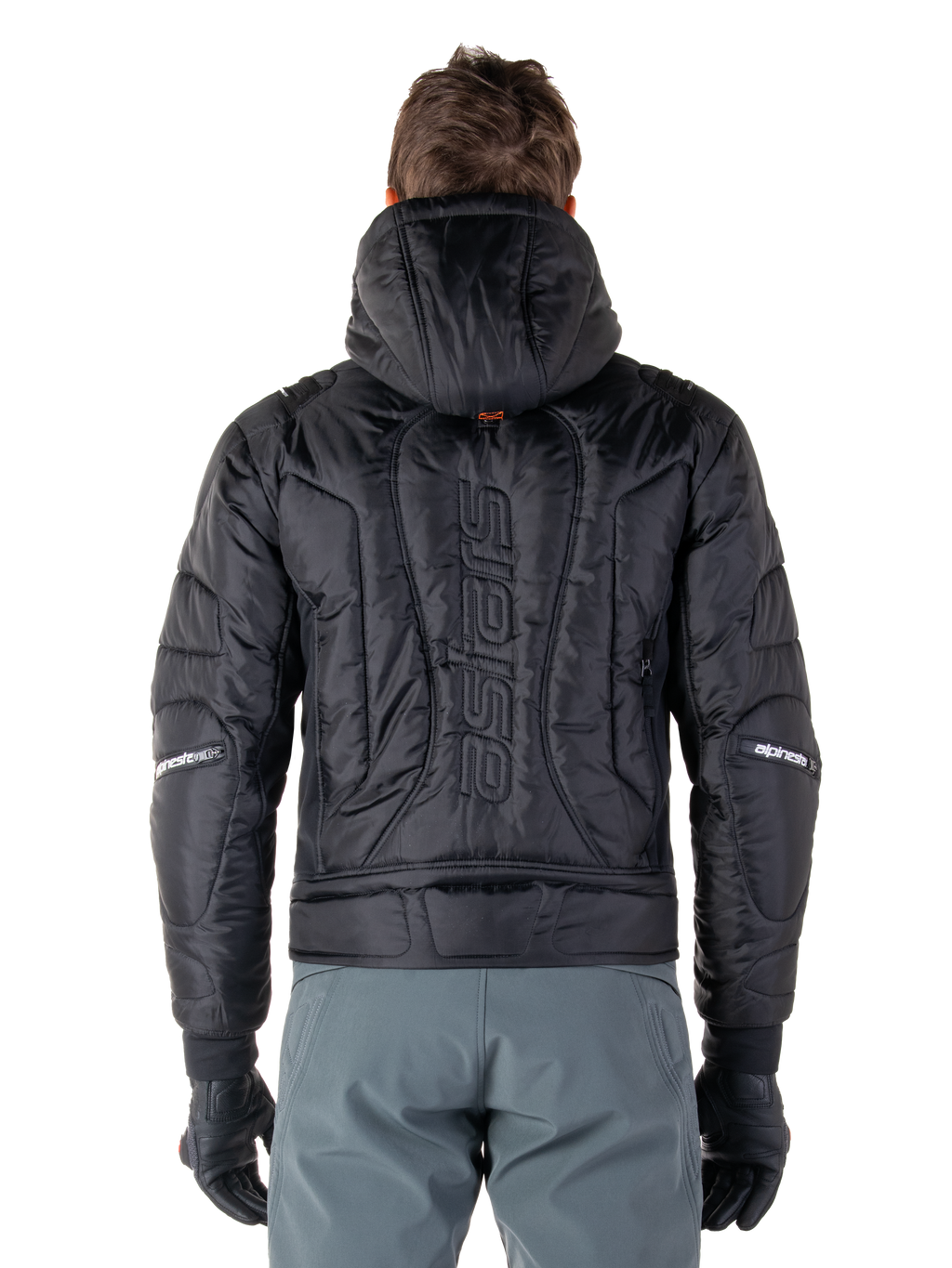 Alpinestars Mohobbs Waterproof jas, zwart, achteraanzicht met gewatteerde gevoerde constructie, verticaal 'astars' woordmerk op de rug, capuchon omhoog, eigentijdse moto streetwear stijl