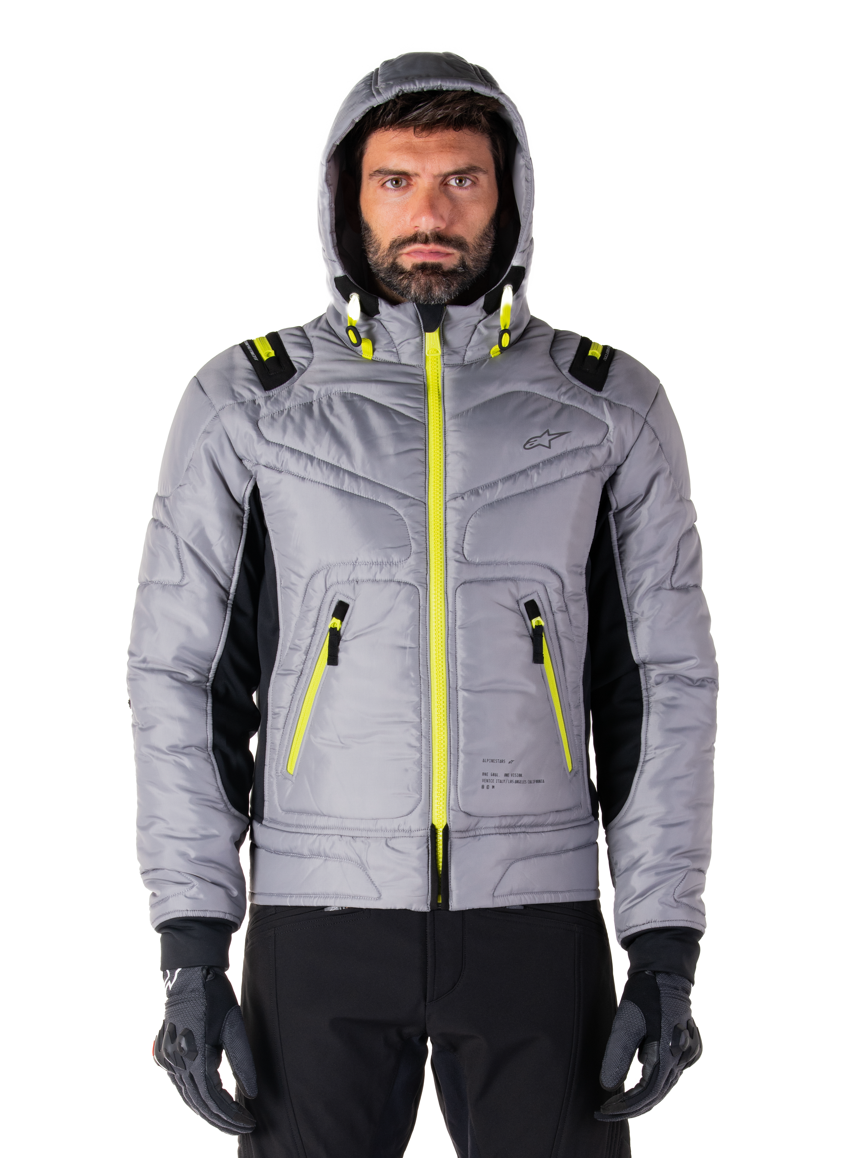 Alpinestars Mohobbs Waterproof jas, motor bomberjack, Lunar Gray en Lime Punch, gewatteerd ontwerp met felle neongele ritsen en accenten op de capuchon, moderne urban moto streetwear.