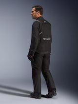 Alpinestars Cusco Drystar® Jacket, Black motorcycle jacket, back view of male model wearing full riding gear, featuring reflective branding on the back, textile construction with technical panels, coordinated outfit for road adventure touring