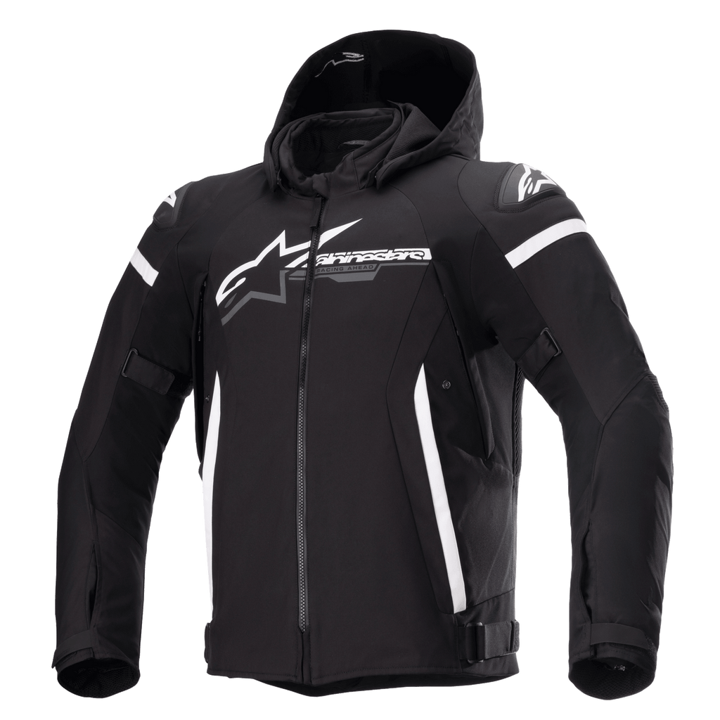 Alpinestars Zaca Waterproof Jacket, Black motorcycle jacket with detachable hood, large white Alpinestars logo on chest, white stripes on upper arms and vertical side accents, front zipper, reinforced shoulder padding, adjustable straps on waist and arms, textile softshell construction