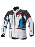 Alpinestars Honda Bogota' Pro Drystar® motorjas, touring motorjas, ijsgrijs, blauw en felrood, technisch textielontwerp met meerdere ritsen en zakken, verstelbare banden op de taille en armen, voorzien van Alpinestars en Honda logo's, waterdichte en ademende all-season touringbescherming.