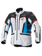Alpinestars Honda Bogota' Pro Drystar® motorjas, touring motorjas, ijsgrijs, blauw en felrood, technisch textielontwerp met meerdere ritsen en zakken, verstelbare banden op de taille en armen, voorzien van Alpinestars en Honda logo's, waterdichte en ademende all-season touringbescherming.