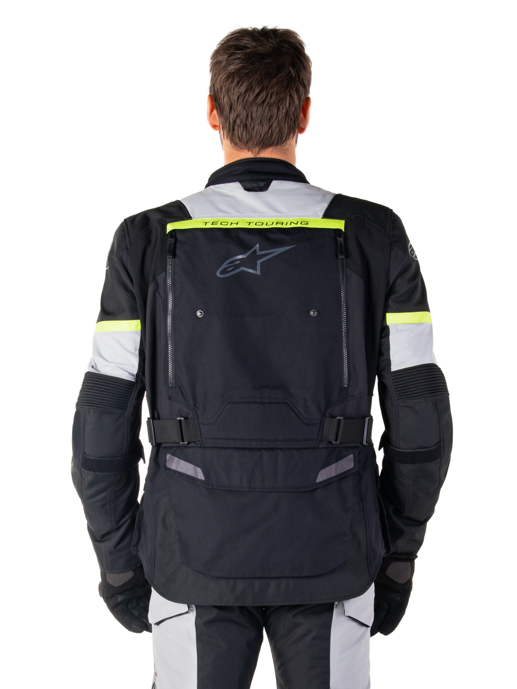 Alpinestars Bogota' Pro Drystar® Jas, Adventure Touring motorjas, Black Ice Gray en Yellow Fluo, achteraanzicht met 'TECH TOURING' branding op een fluorescerende gele streep, groot ventilatiepaneel op de rug en verstelbare taillebanden, technische all-season uitrusting