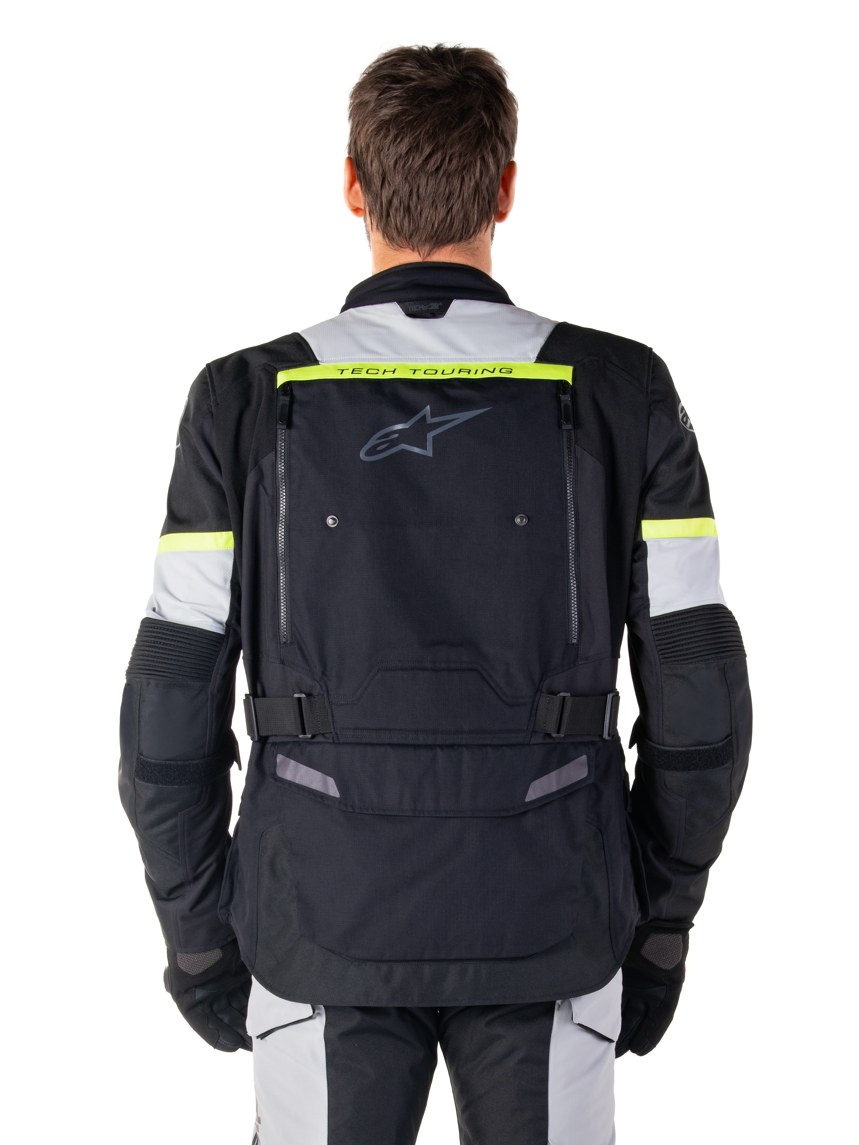 Alpinestars Bogota' Pro Drystar® Jas, Adventure Touring motorjas, Black Ice Gray en Yellow Fluo, achteraanzicht met 'TECH TOURING' branding op een fluorescerende gele streep, groot ventilatiepaneel op de rug en verstelbare taillebanden, technische all-season uitrusting