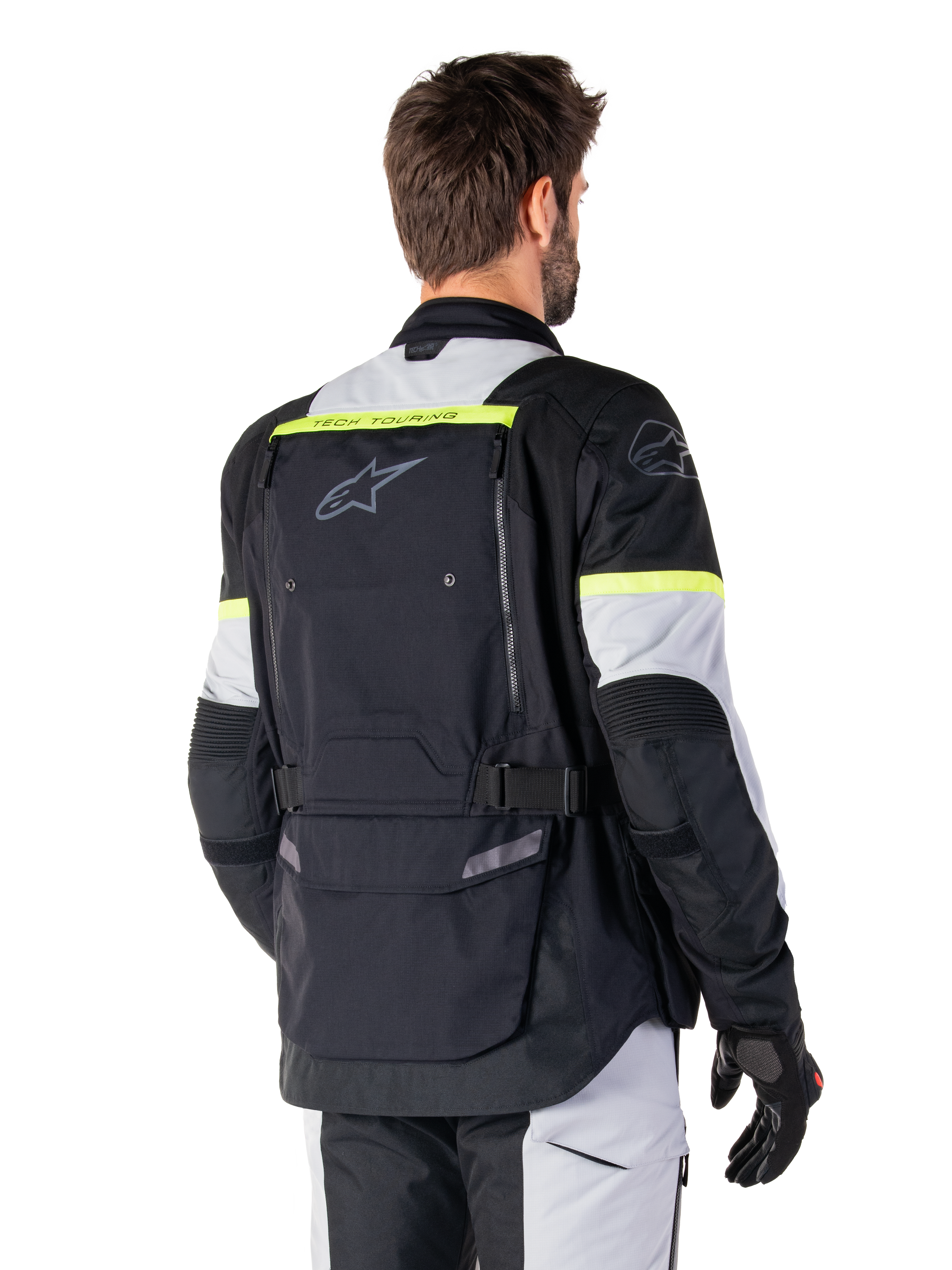 Alpinestars Bogotá Pro Drystar® Jas, adventure touring jas, Black Ice Gray en Yellow Fluo, achteraanzicht met groot achterzakpaneel met 'TECH TOURING'-branding, Alpinestars-logo en fluorescerende accenten, technische textiele motorkleding