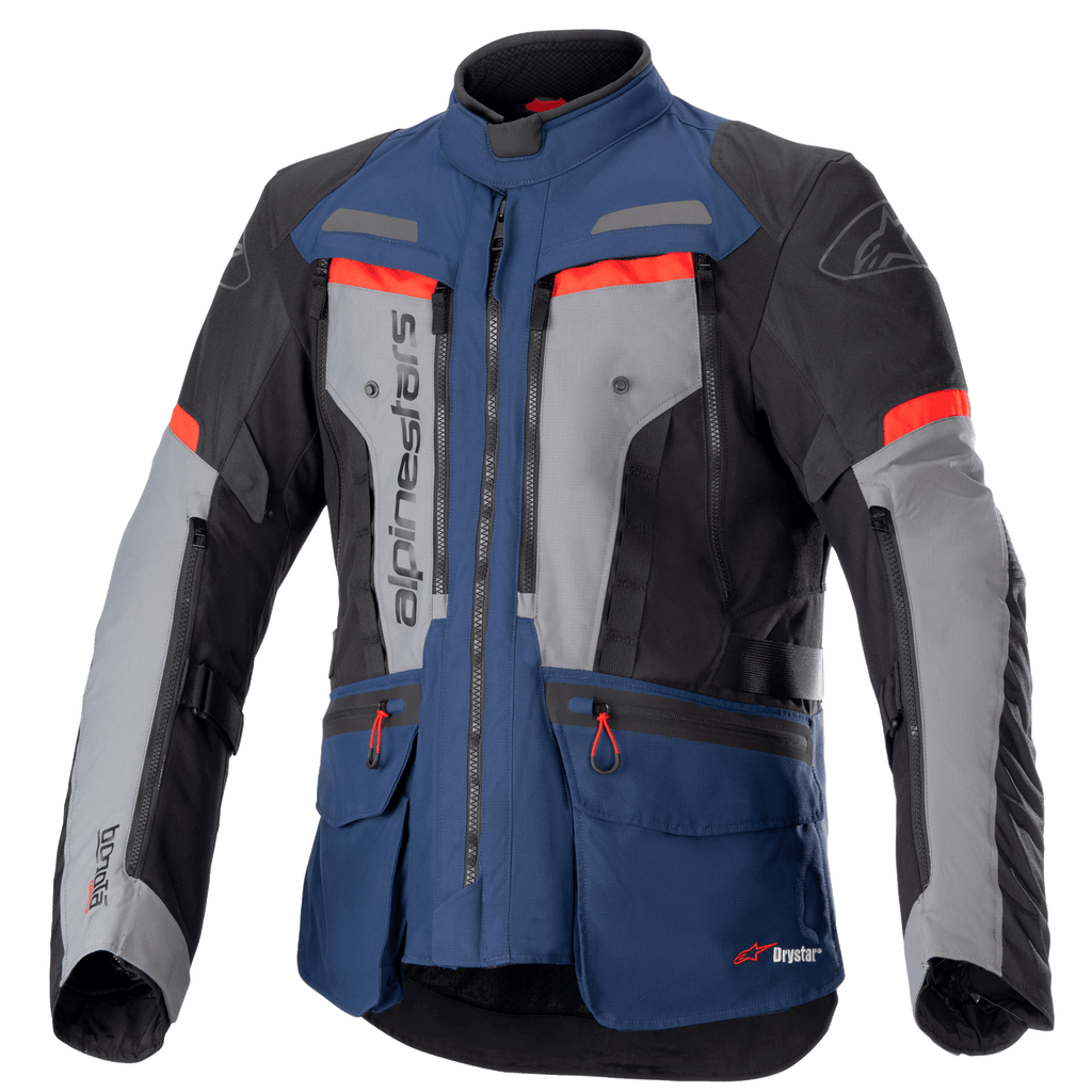 Alpinestars Bogota Pro Drystar motorjas, adventure touring motorjas, donkerblauw en zwart met grijze borstpanelen en felrode accenten, waterdichte textielconstructie, meerdere ventilatieritsen en handige opbergzakken
