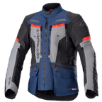 Alpinestars Bogota Pro Drystar motorjas, adventure touring motorjas, donkerblauw en zwart met grijze borstpanelen en felrode accenten, waterdichte textielconstructie, meerdere ventilatieritsen en handige opbergzakken